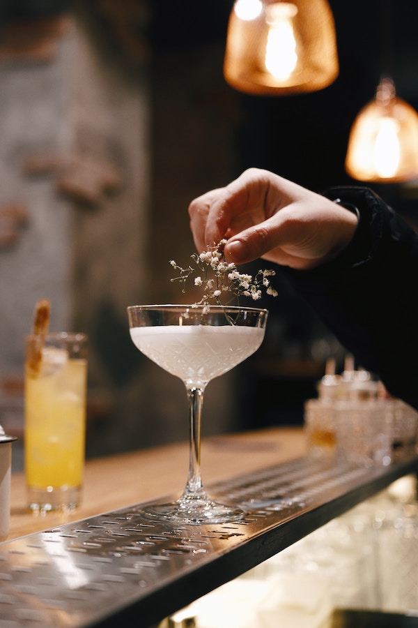 a cocktail with some flowers